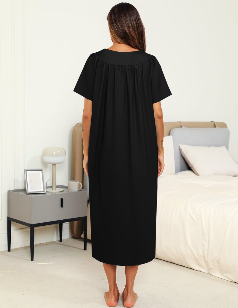 Back view of black pleated-front nightgown with short sleeves
