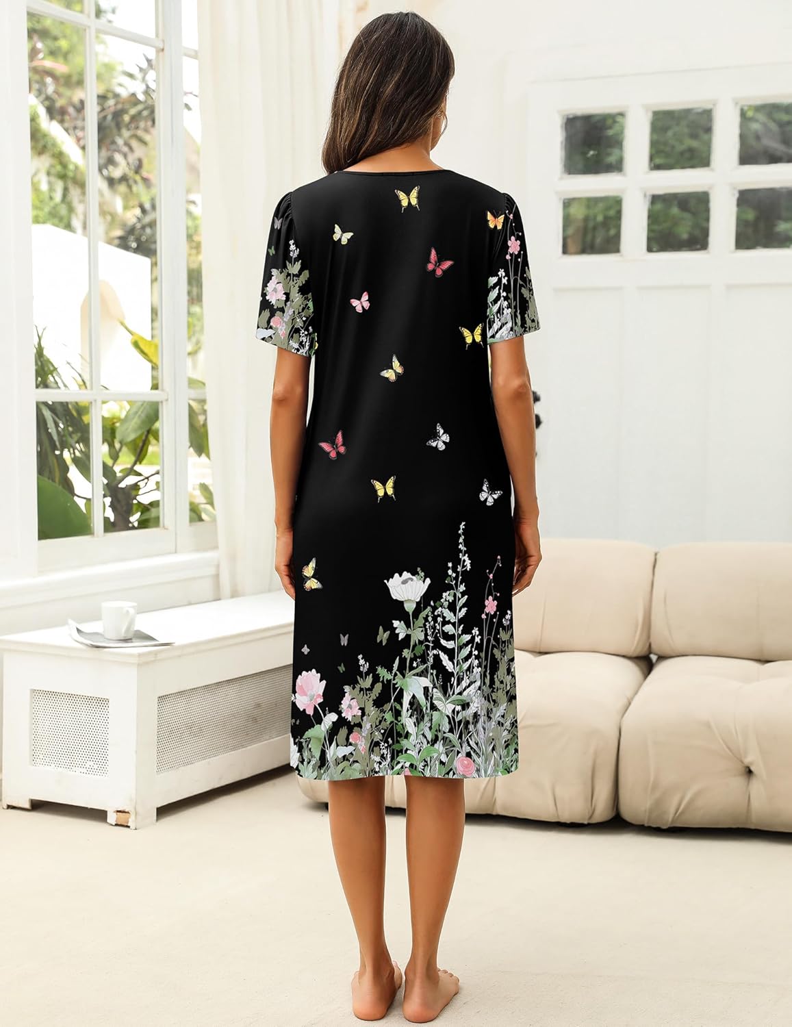House dress black with all-over butterfly floral print, short sleeves, back view
