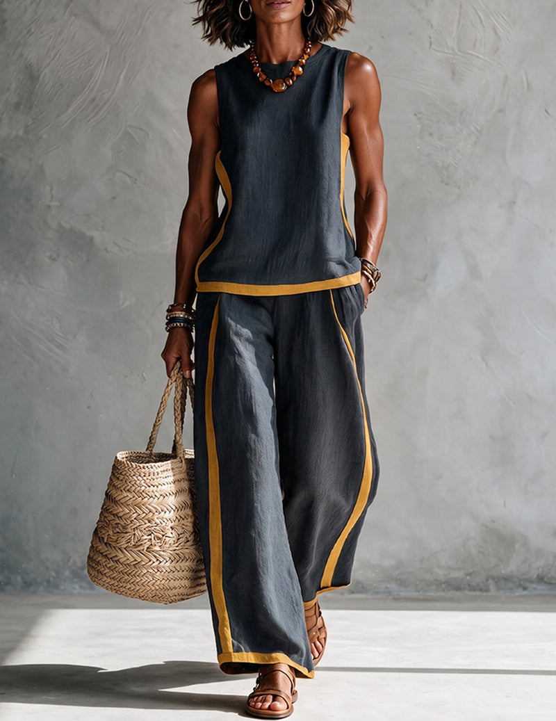 Dark charcoal sleeveless top and wide-leg pants set with gold contrast trim