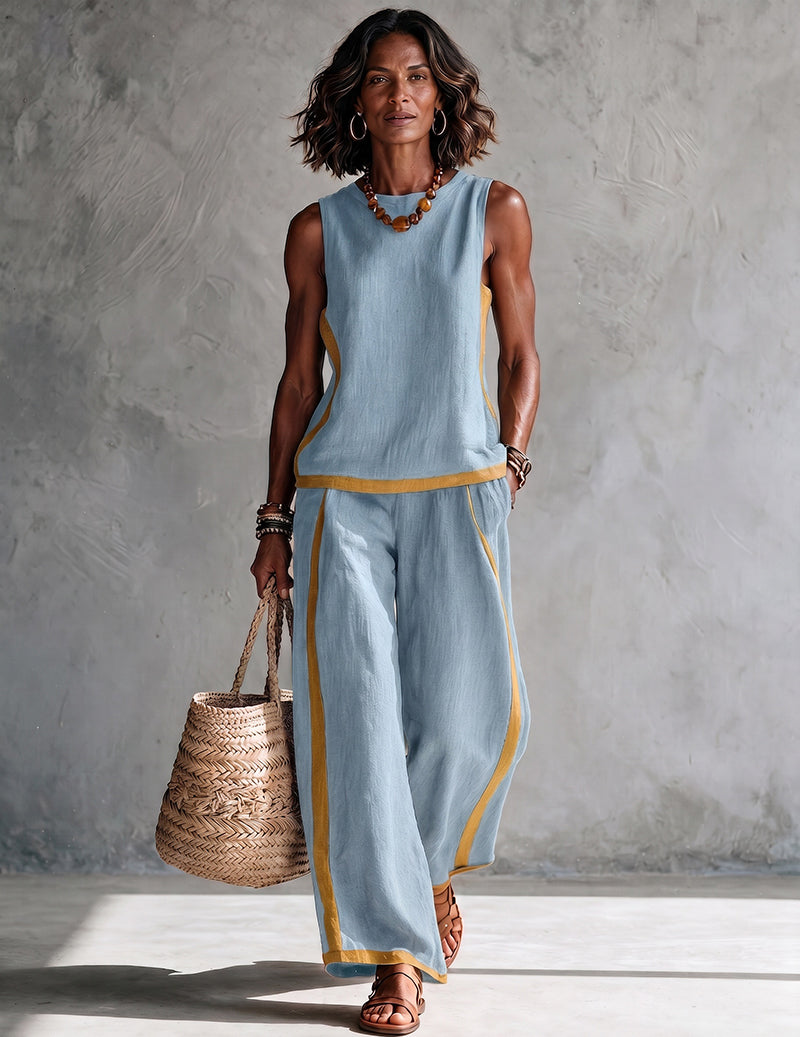Light blue sleeveless top and wide-leg pants set with gold trim at hem and sides