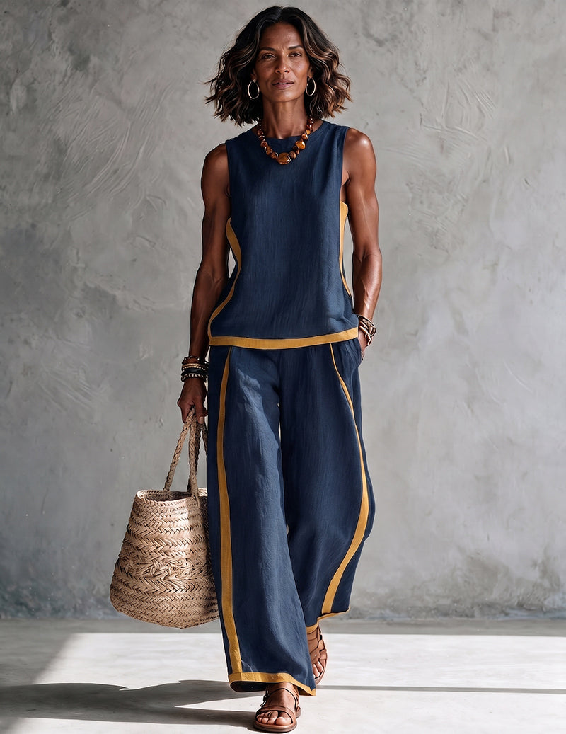 Navy sleeveless top and wide-leg pants set with gold trim at neckline and pant hems