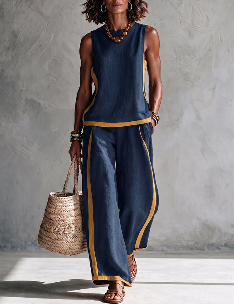 Navy sleeveless top and wide-leg pants set with gold contrast trim along edges