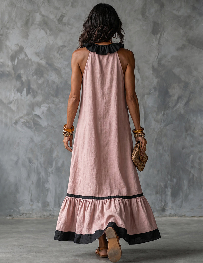Pink cotton-linen halter maxi dress, back view with black ruffled yoke and hem trim