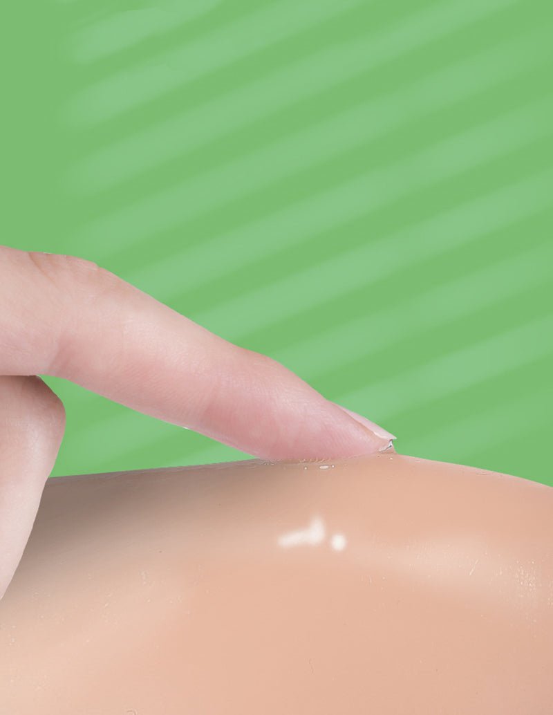 Reusable nipple cover with thin translucent adhesive pad on skin