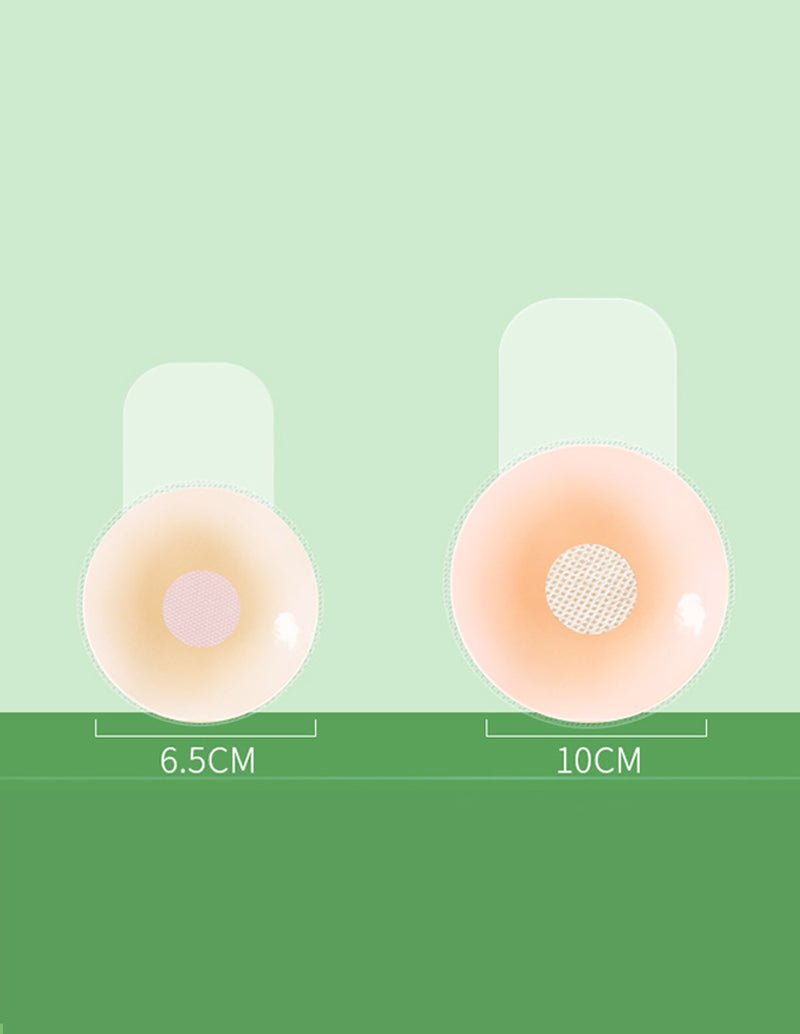 Reusable nipple covers set, one 6.5 cm and one 10 cm beige pad with mesh center.