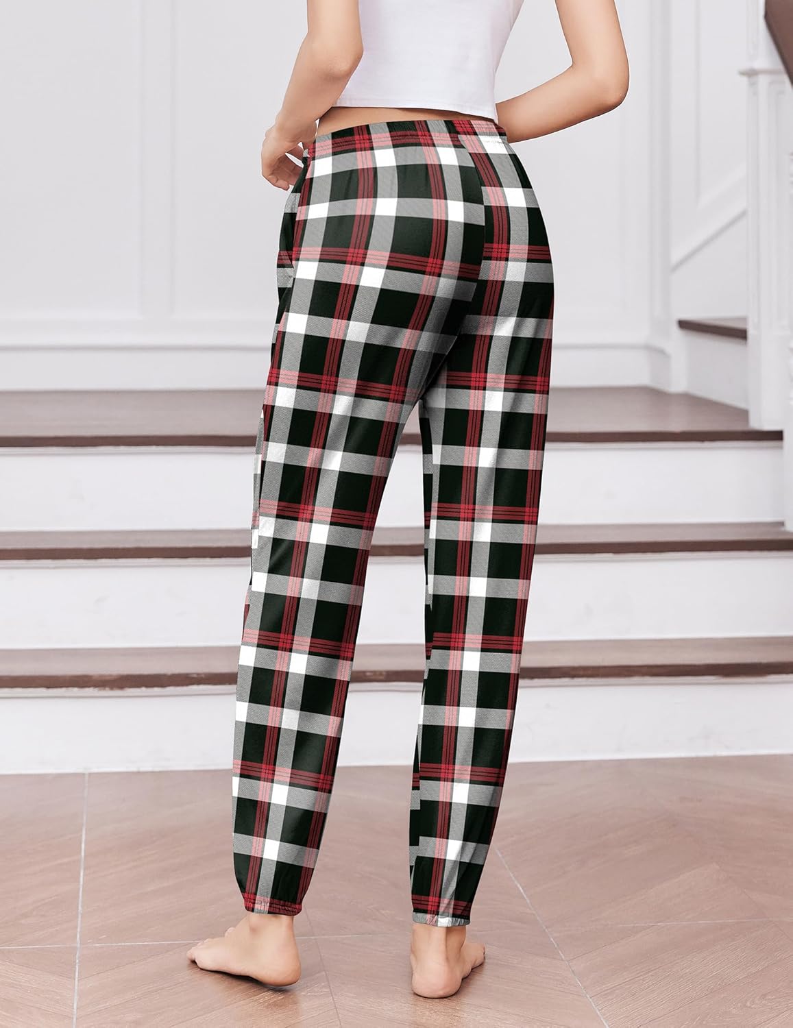 Tartan plaid lounge jogger pants in black, green, and red with elastic cuffs
