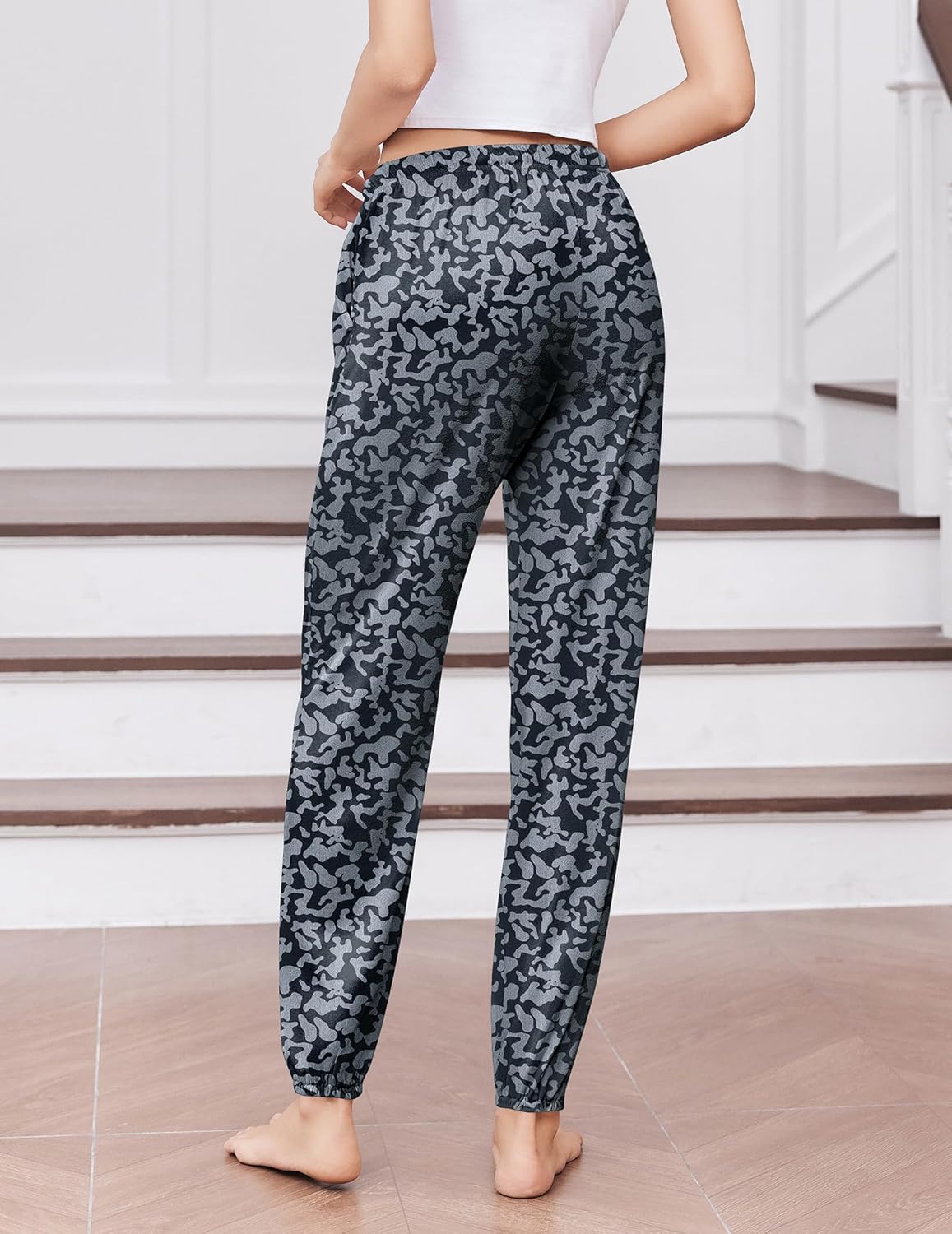 Charcoal black camo-style pajama joggers with elastic waistband and tapered ankle cuffs