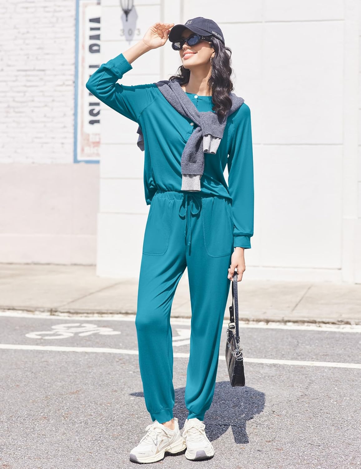 Blue-green lounge set with henley long sleeves, cinched waist, and tapered joggers
