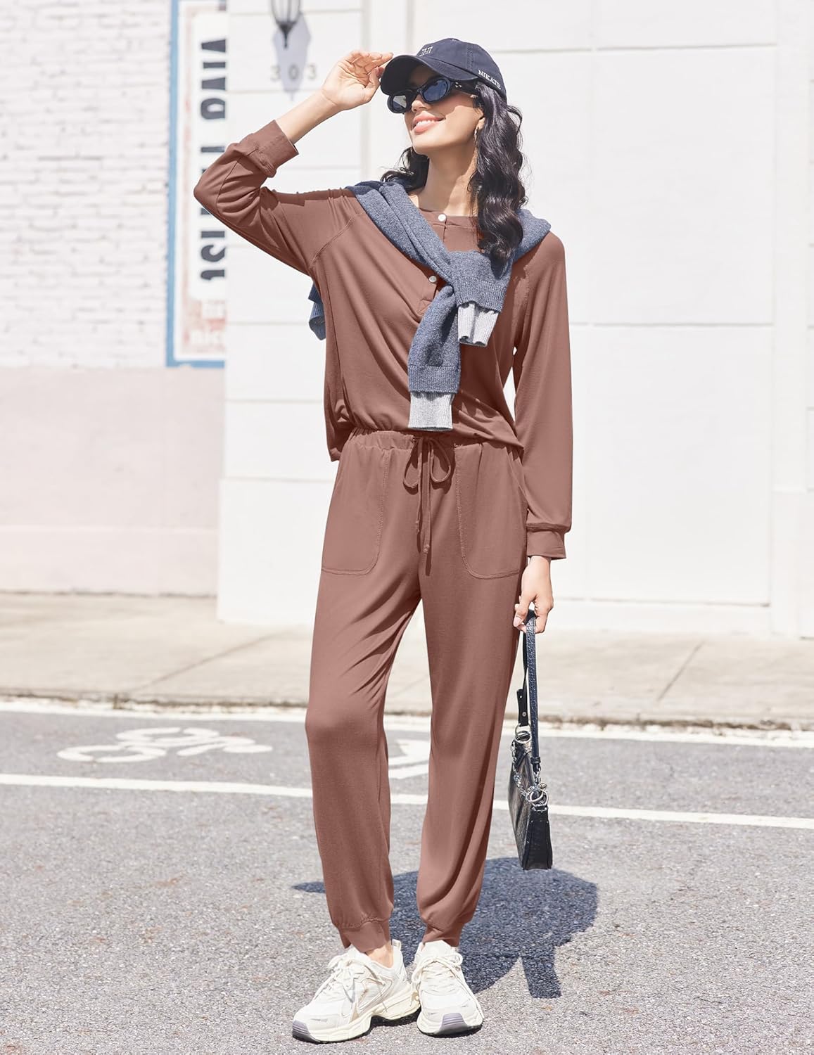 Brown jogger set outdoors: drawstring pants and long-sleeve button henley top
