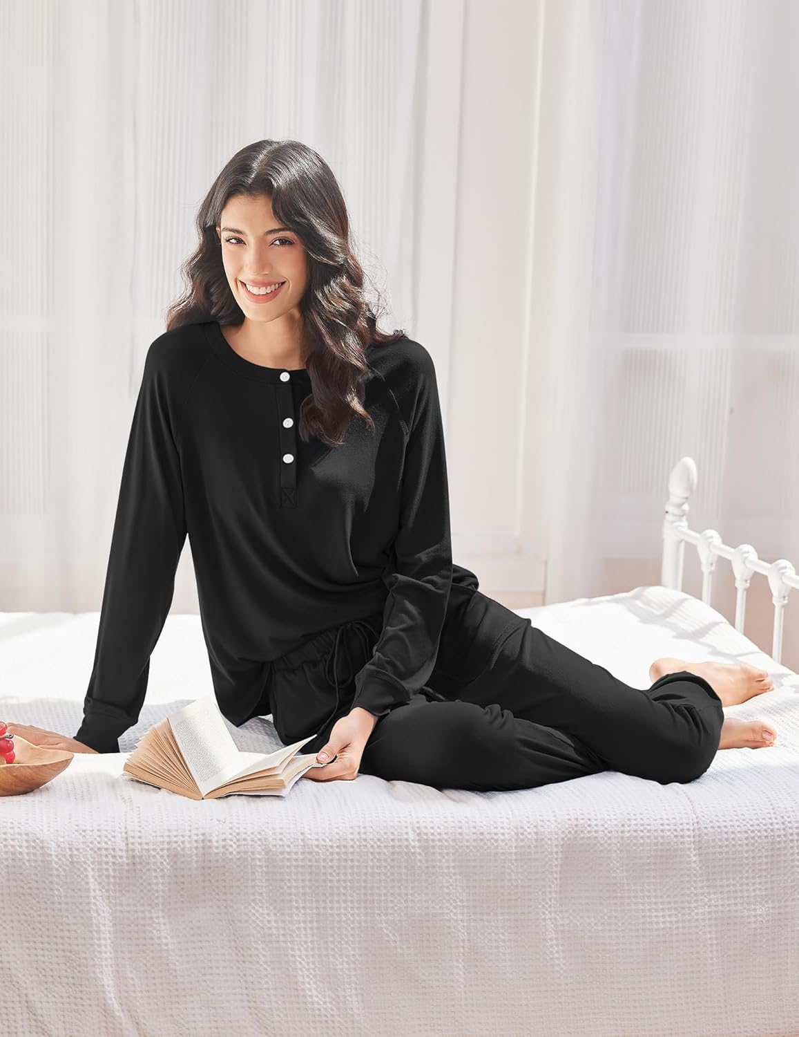 Black long-sleeve pajama set with henley-style neckline and tapered jogger pants