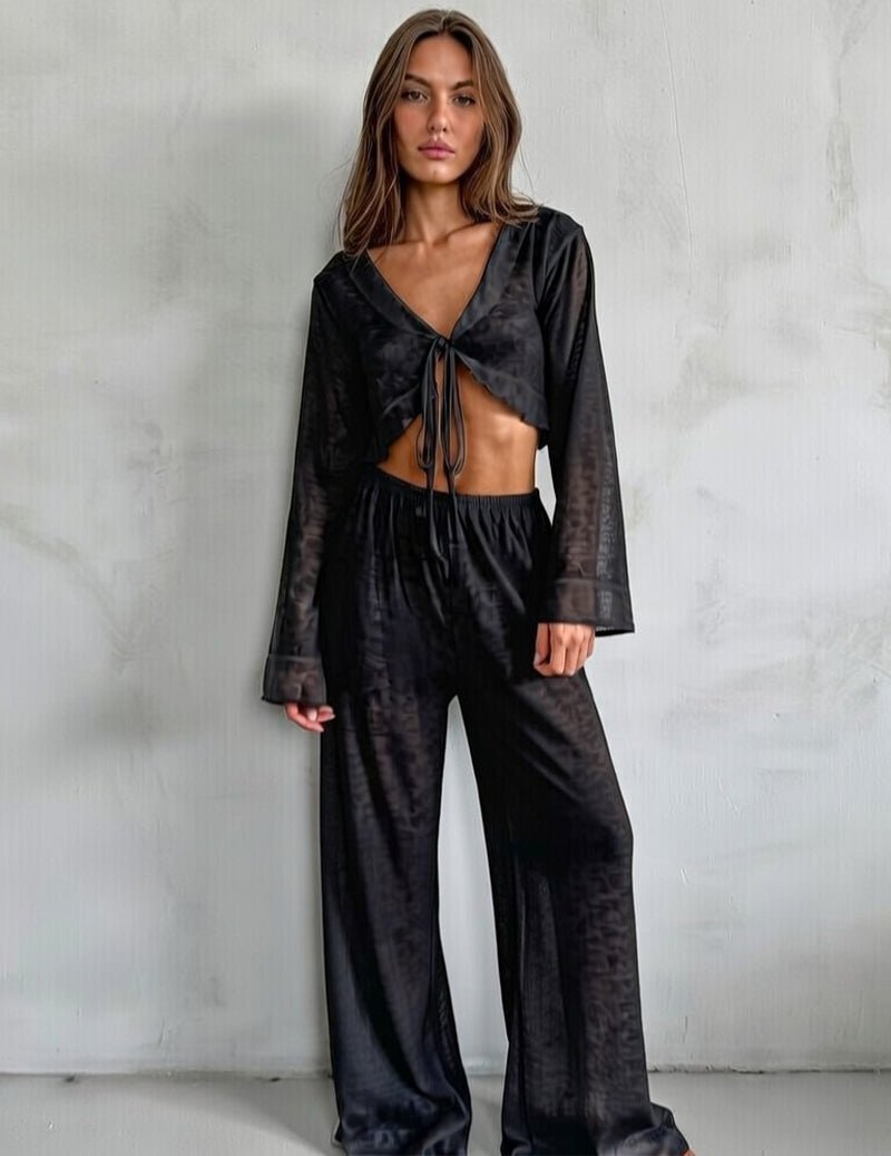 Black knit pajama set long pants with drawstring waist and tie-front cropped top