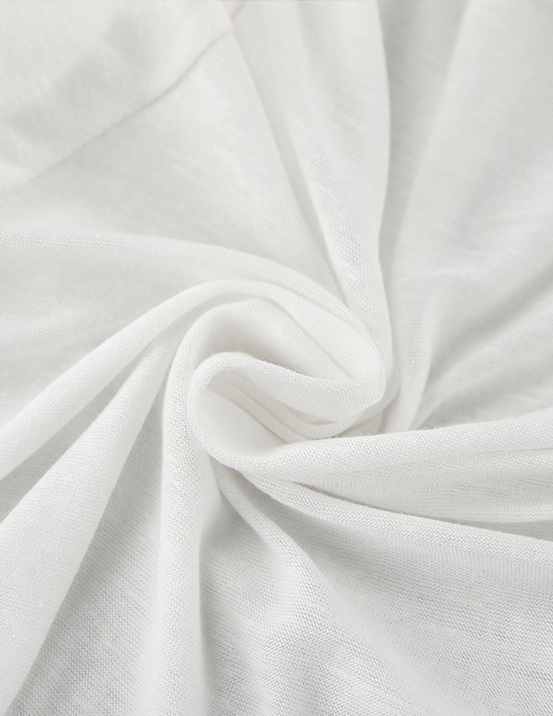 White knit fabric close-up with soft drape and fine texture