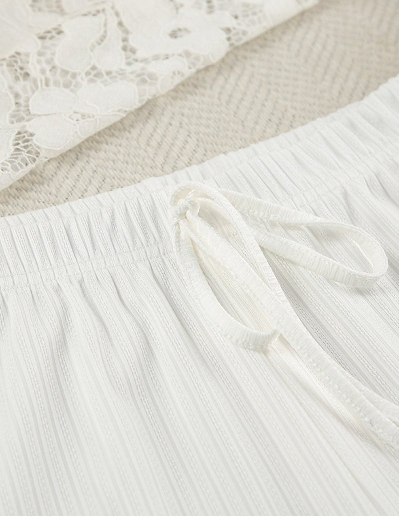 White knit lounge set skirt with gathered fabric and tied drawstring
