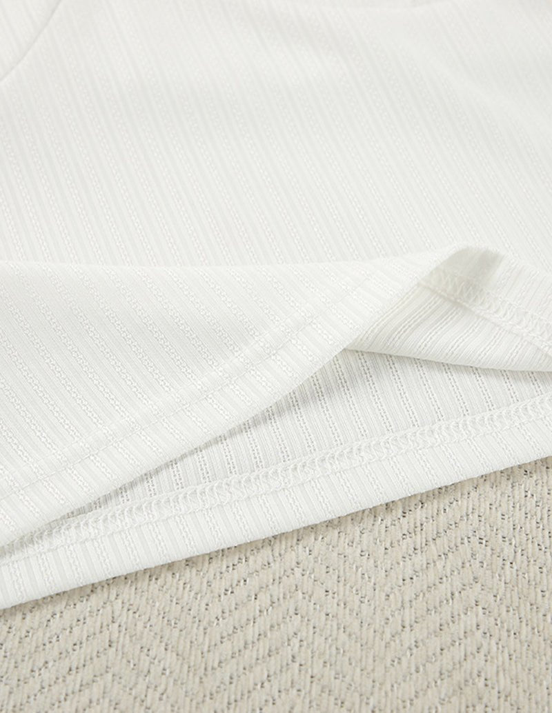 White ribbed knit fabric with fine vertical texture
