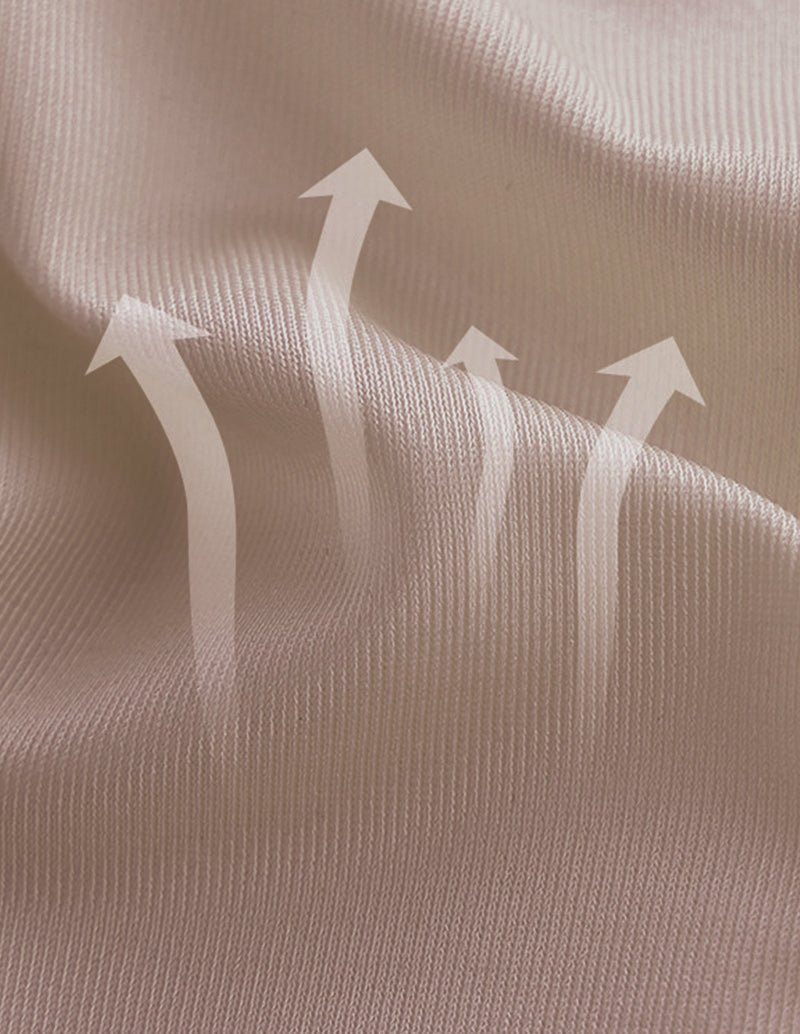 Beige shaping fabric close-up with stretch texture and arrow indicators on material