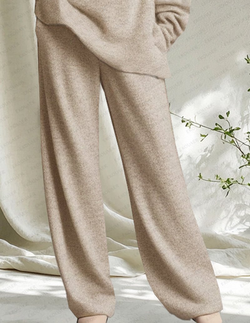 Beige knit jogger pants with elastic cuffs and relaxed straight legs