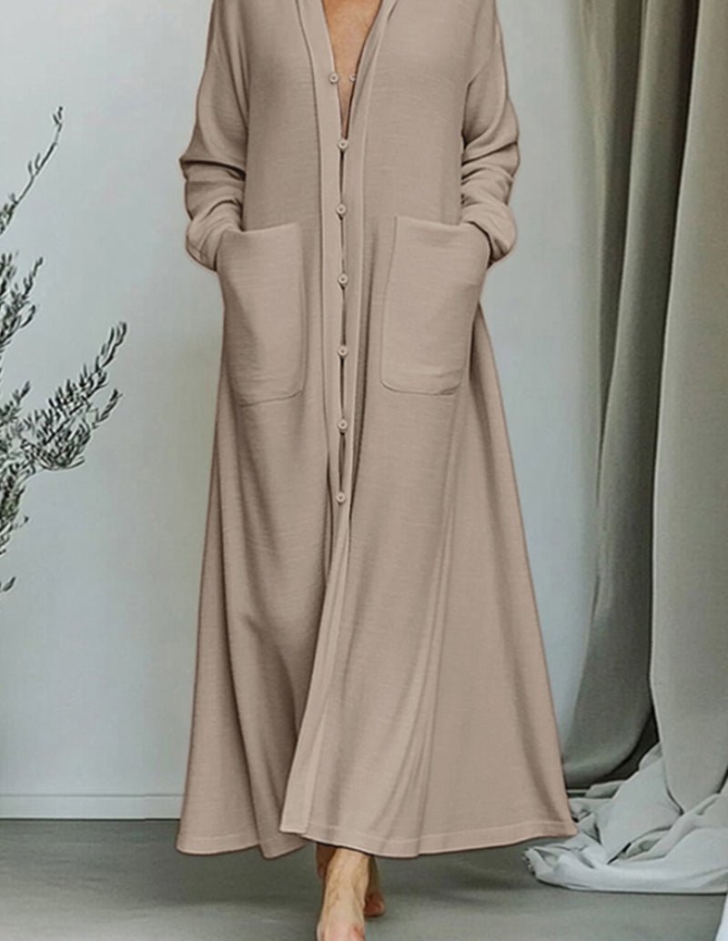 Beige longline cardigan with long sleeves, V-neck, and side patch pockets