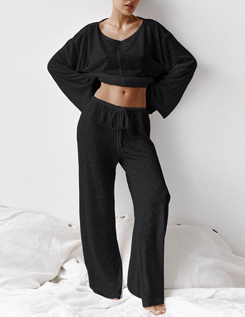 Black knit loungewear set with cropped top and drawstring pants