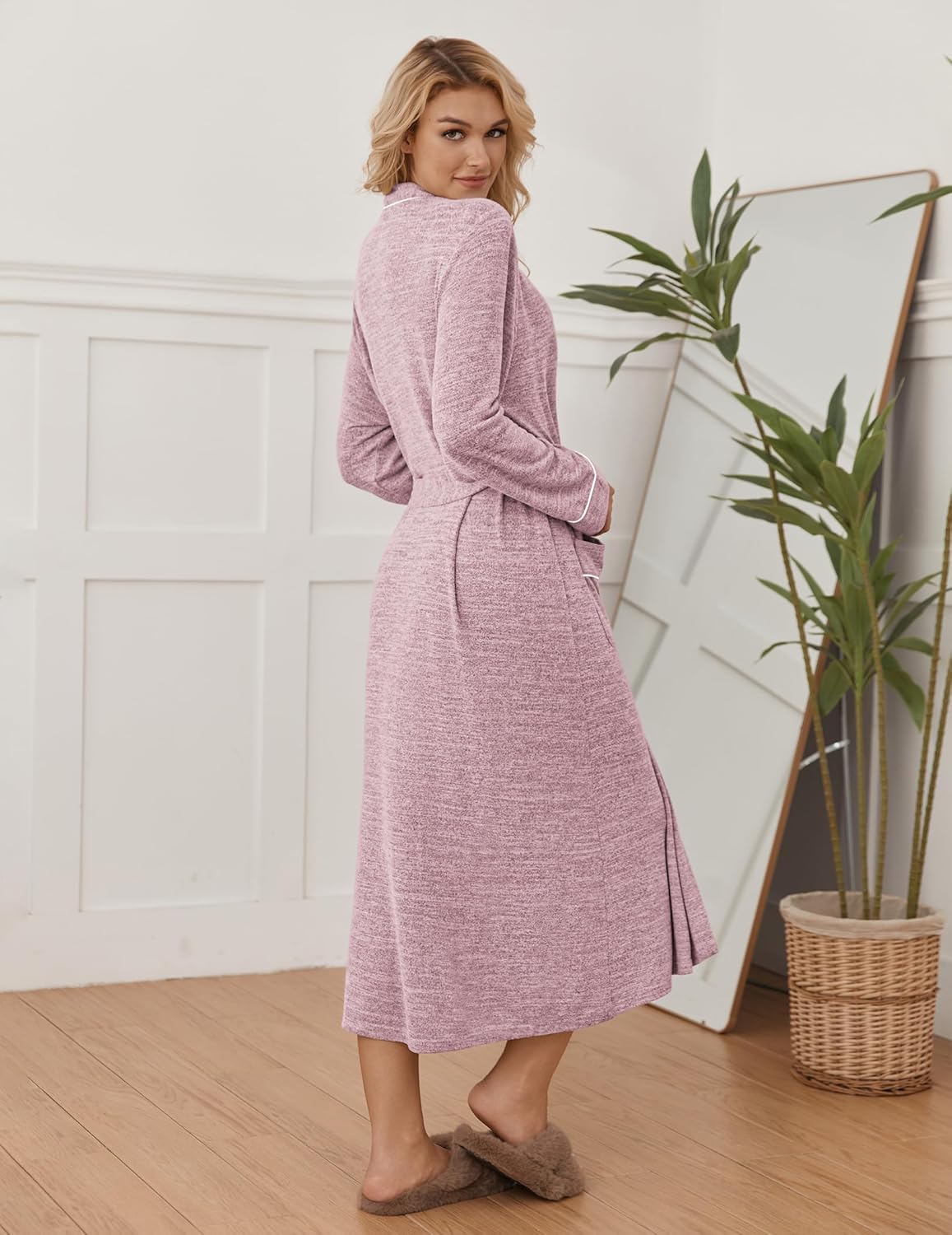 Long pink kimono-style robe with tie waist and contrast piping, draped long sleeves.