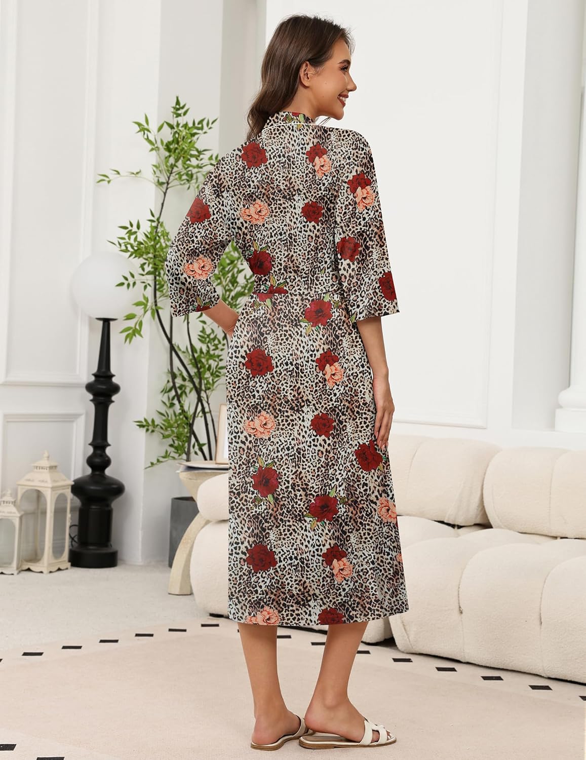 Long knit kimono bathrobe, leopard print with red floral motifs, belted waist, 3/4 sleeves.