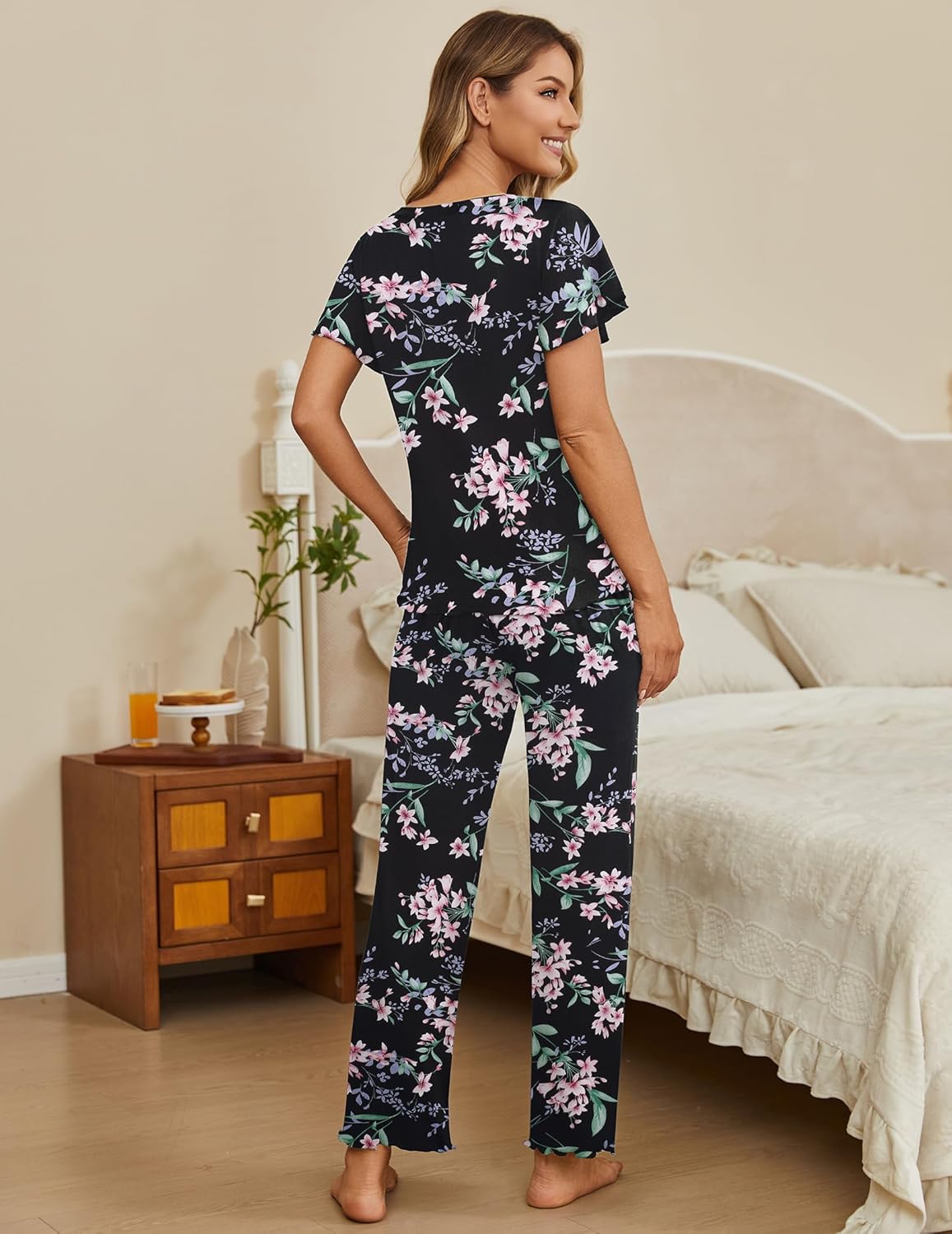 2-piece pajama lounge set with black floral short-sleeve top and matching long pants