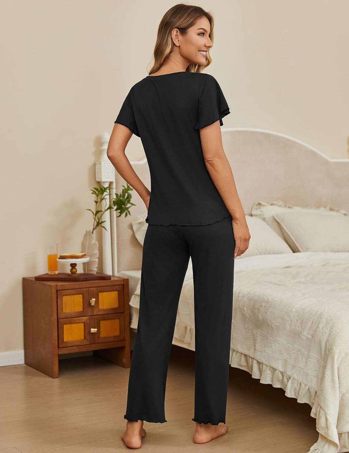 Black 2-piece lounge set with short-sleeve top and long pants, back view