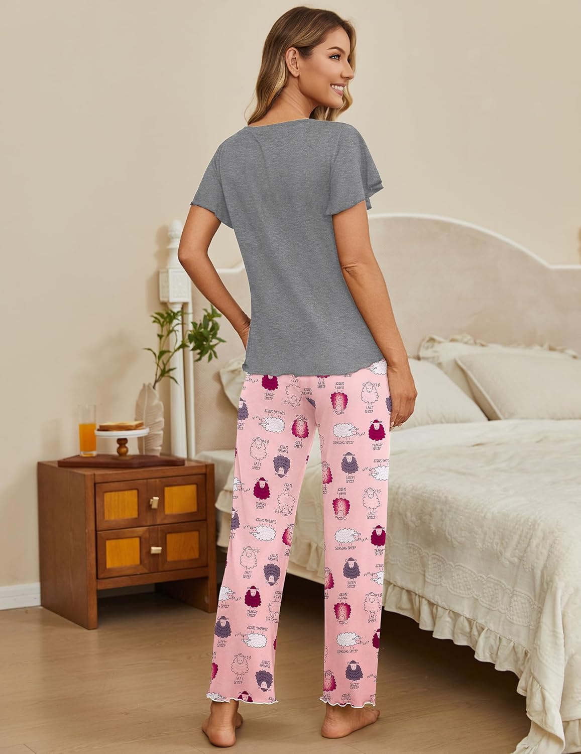 Two-piece lounge pajama set with gray short-sleeve top and pink sheep-print long pants