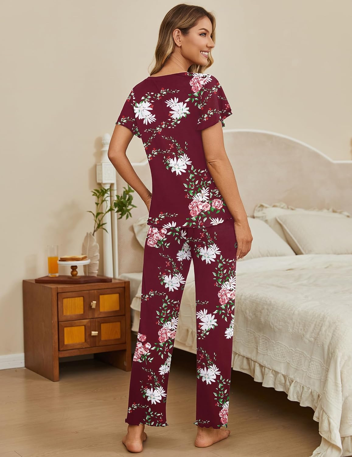 Two-piece lounge pajama set with maroon floral short-sleeve top and matching long pants