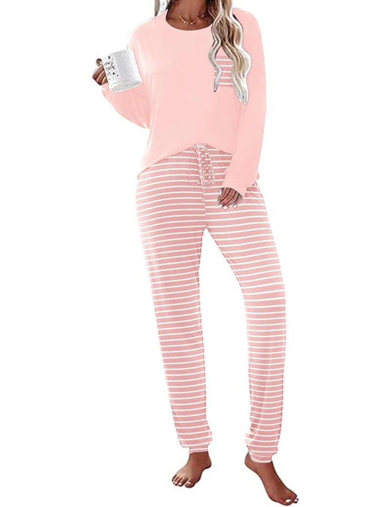 Long Sleeve Christmas PJ set with light pink top and pink-and-white striped joggers
