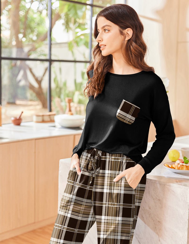 Black long sleeve pajama set with brown-and-cream plaid pants and chest pocket