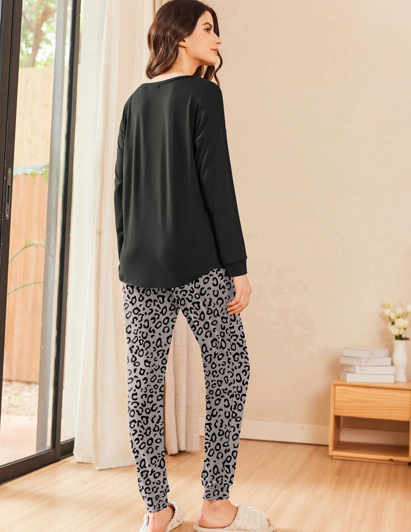 Black long sleeve pajama top with leopard-print jogger pants, back view