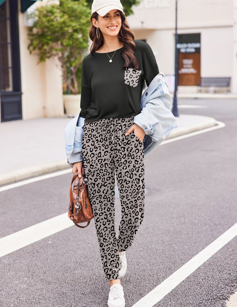 Black long sleeve pajama set with leopard-print pants and pocket accent