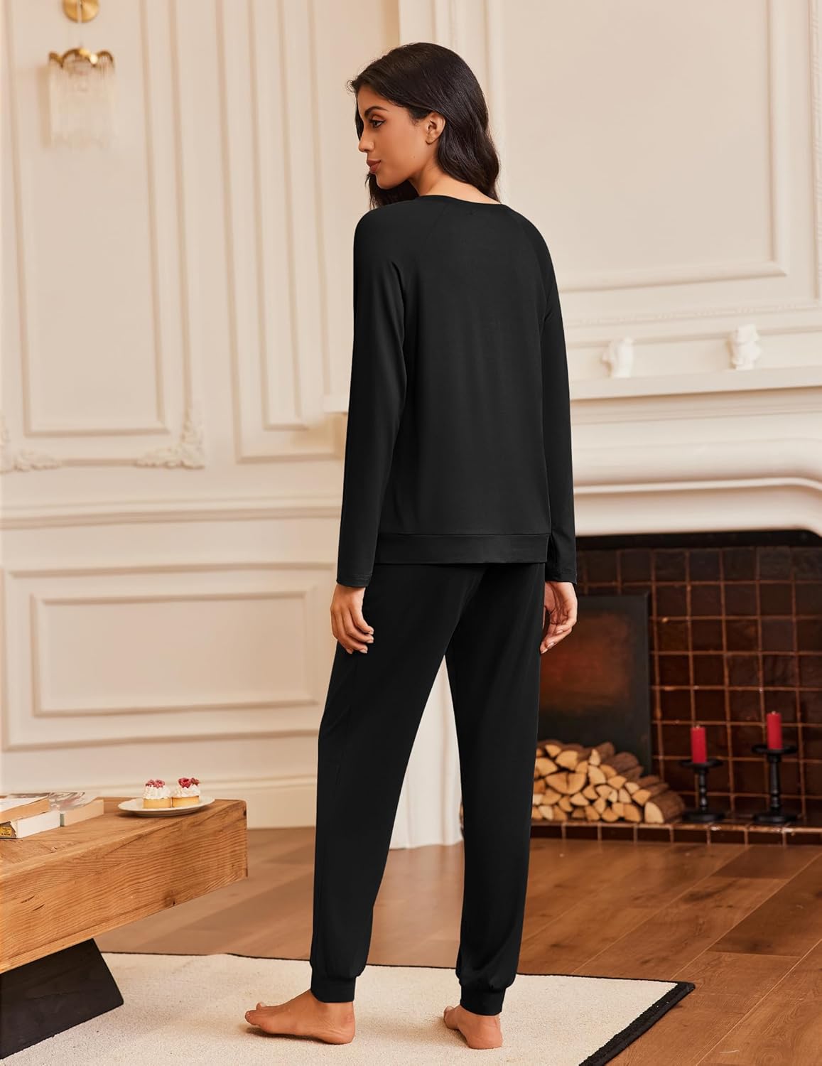 Black long-sleeve pajama set: crew top and matching lounge pants, relaxed fit.
