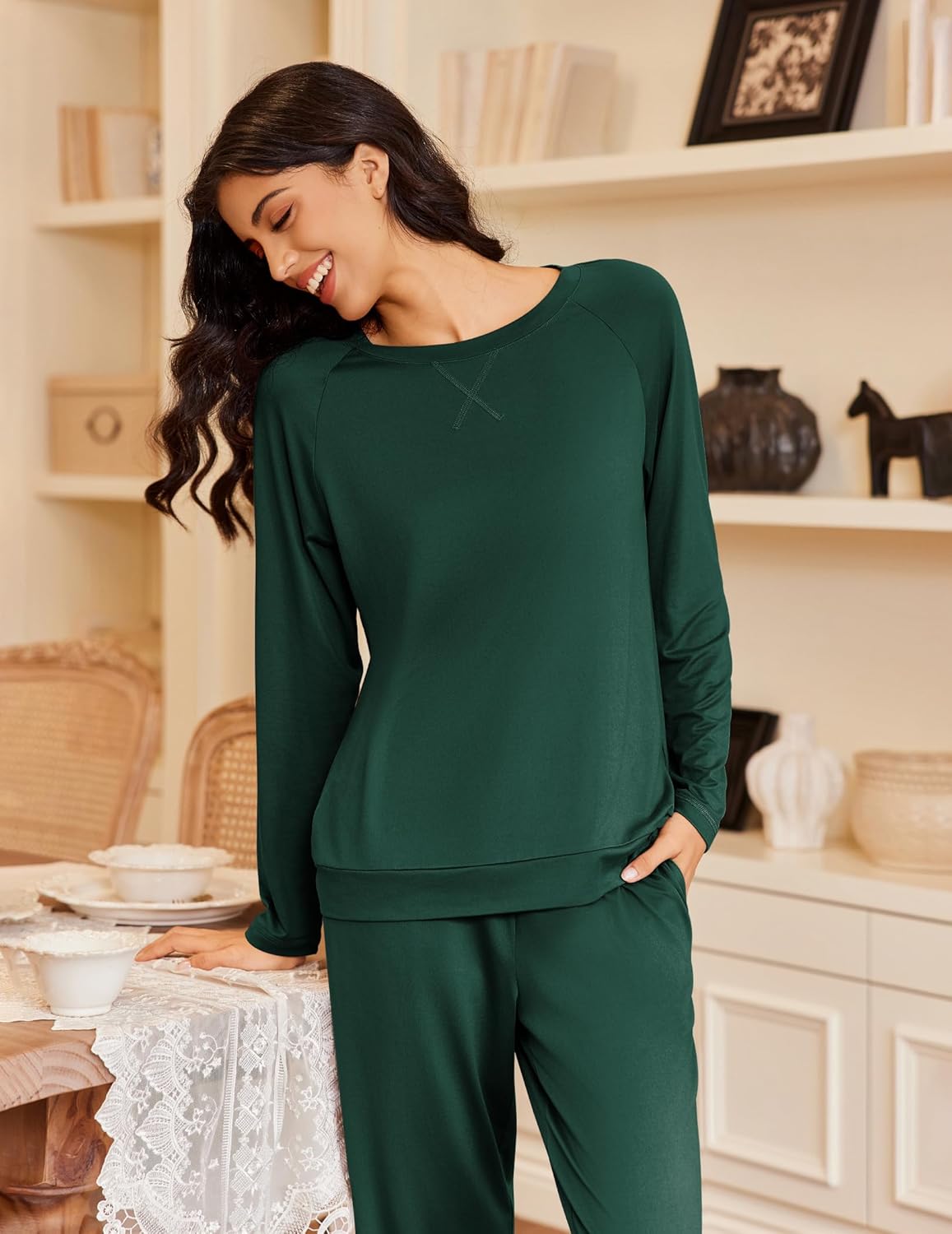 Green long-sleeve sleep top and matching pants set, comfortable relaxed silhouette.