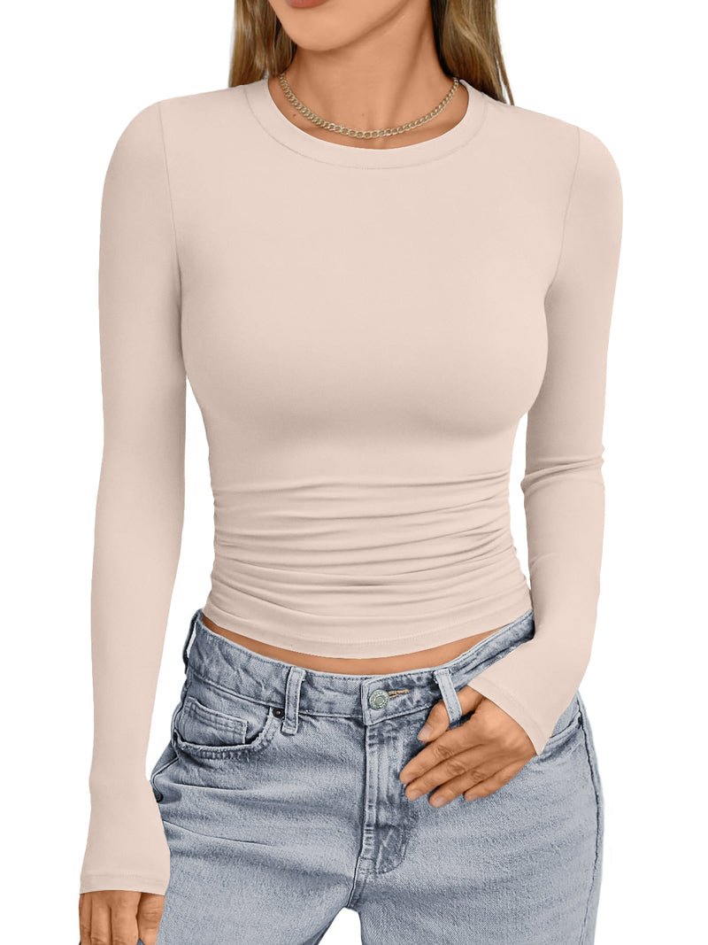 Light beige long-sleeve thermal underwear top with crew neck and fitted ruched waist