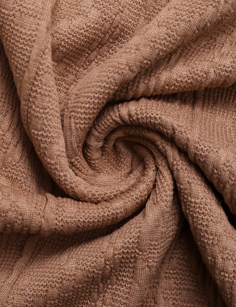 Close-up of Light Brown textured knit fabric with cable-style pattern and drape
