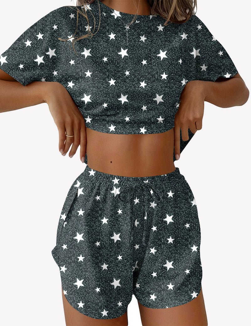 Two-piece pajama set with dark green star print crop top and side-slit shorts