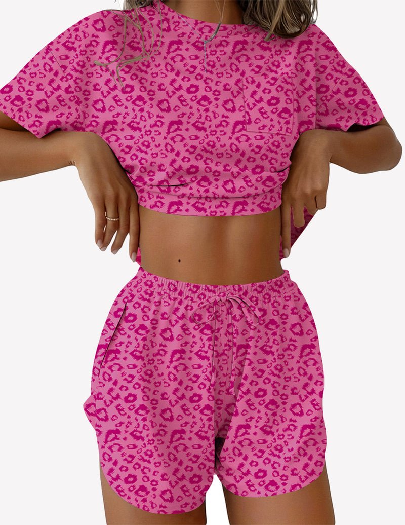 Pink leopard print 2-piece lounge set with short sleeve crop top and drawstring shorts