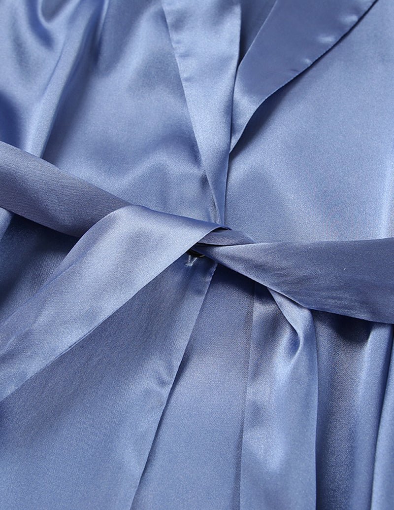 Blue satin pajama front with gathered fabric knot and smooth sheen