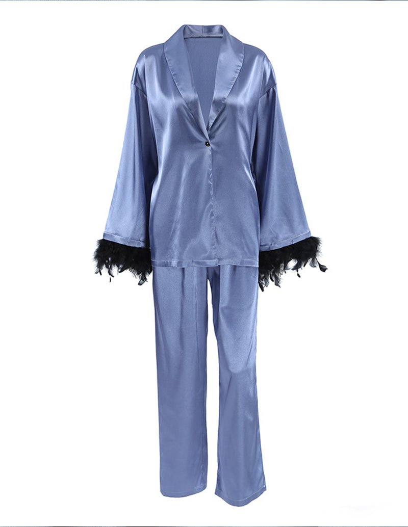 Blue satin pajama set with feather-trim sleeves, button front top and straight pants