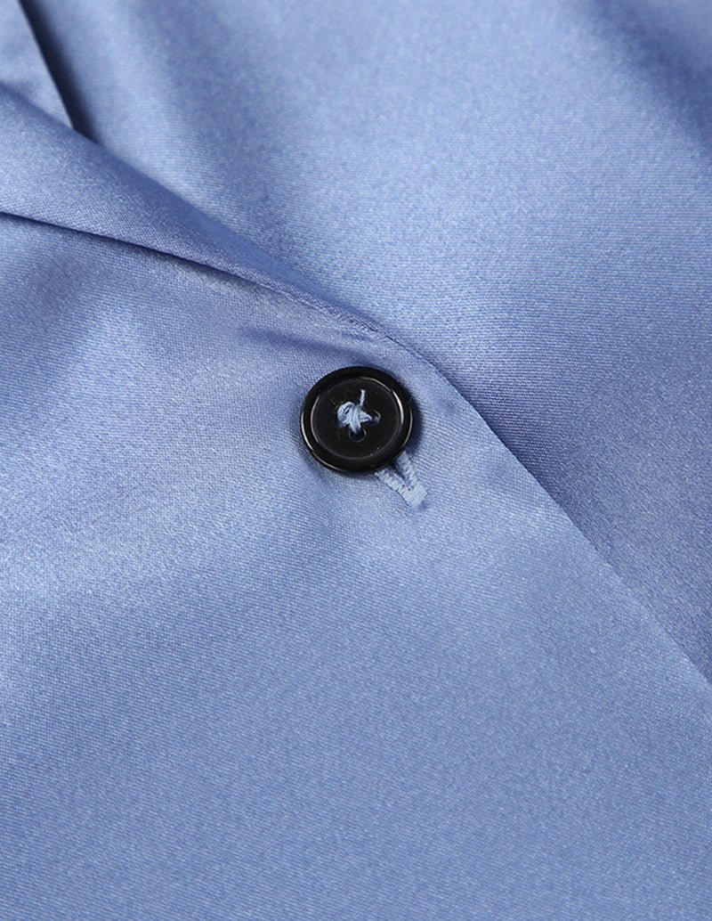 Blue satin pajama button placket detail with dark round button