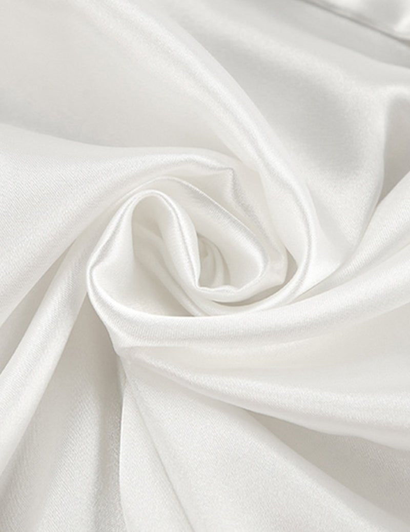 White satin fabric close-up with smooth, glossy sheen
