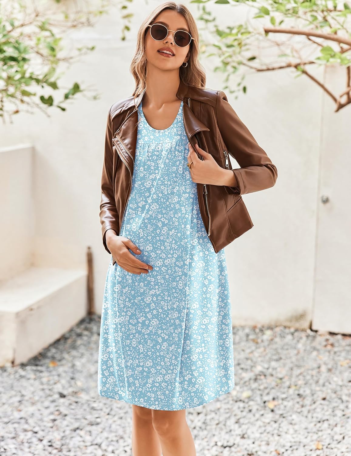Blue floral maternity nursing nightgown, sleeveless with round neckline, shown outdoors