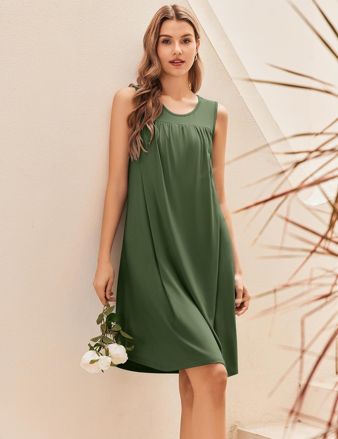 Maternity nursing nightgown dress in green, sleeveless with scoop neck and A-line shape.