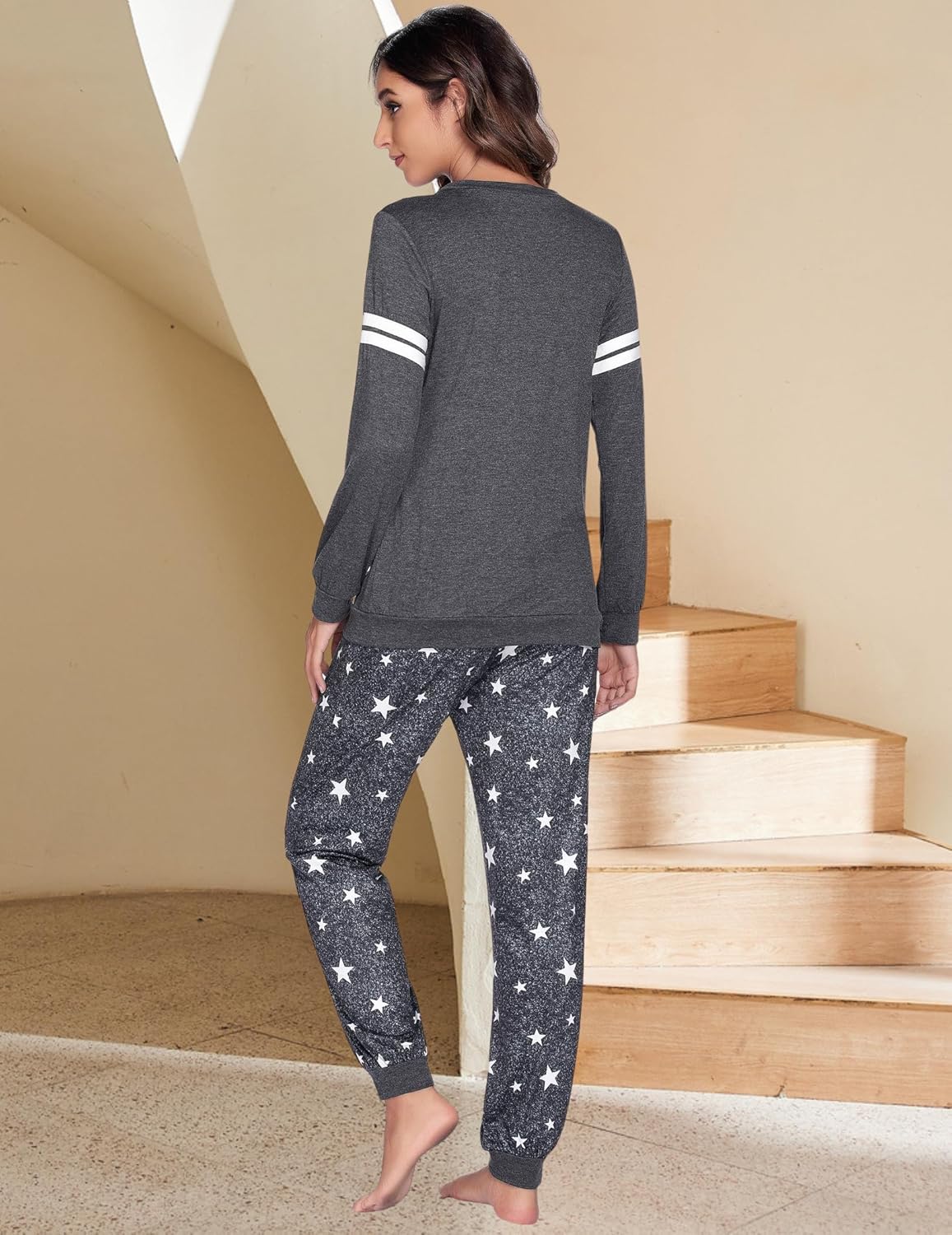 Maternity nursing pajama set back view: grey top with white stripe cuffs, star pants