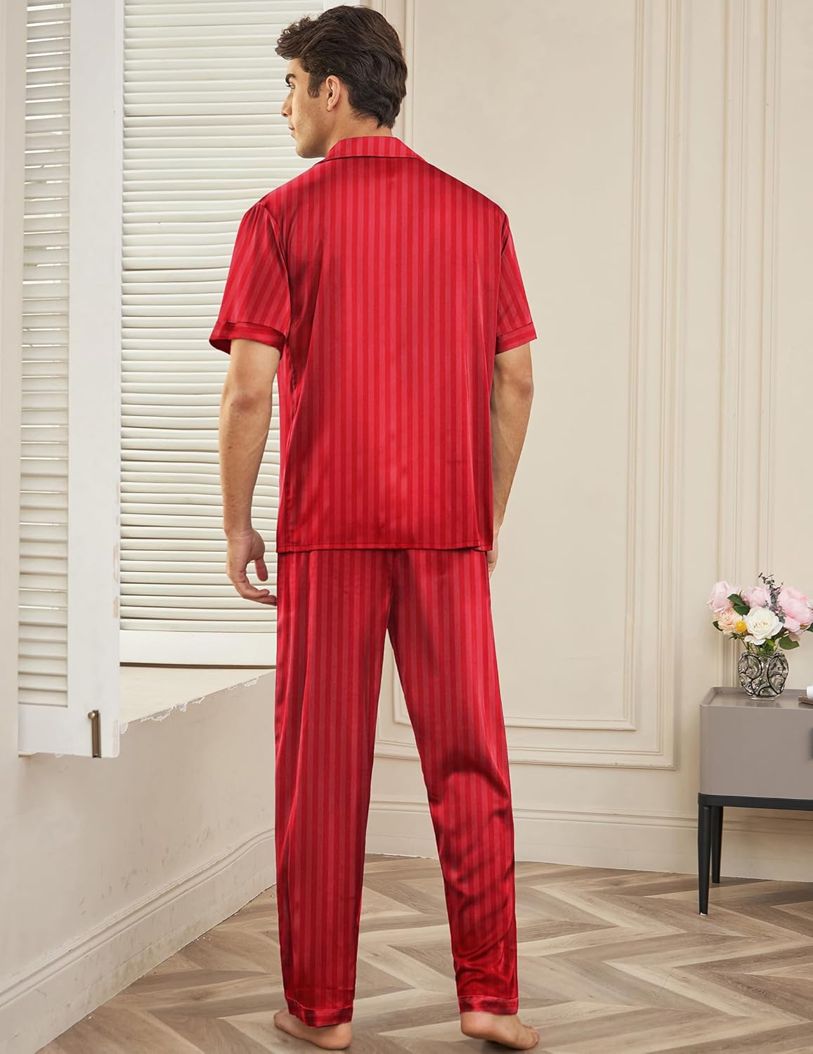 Red striped satin silk pajama set, back view with short-sleeve button shirt and long pants