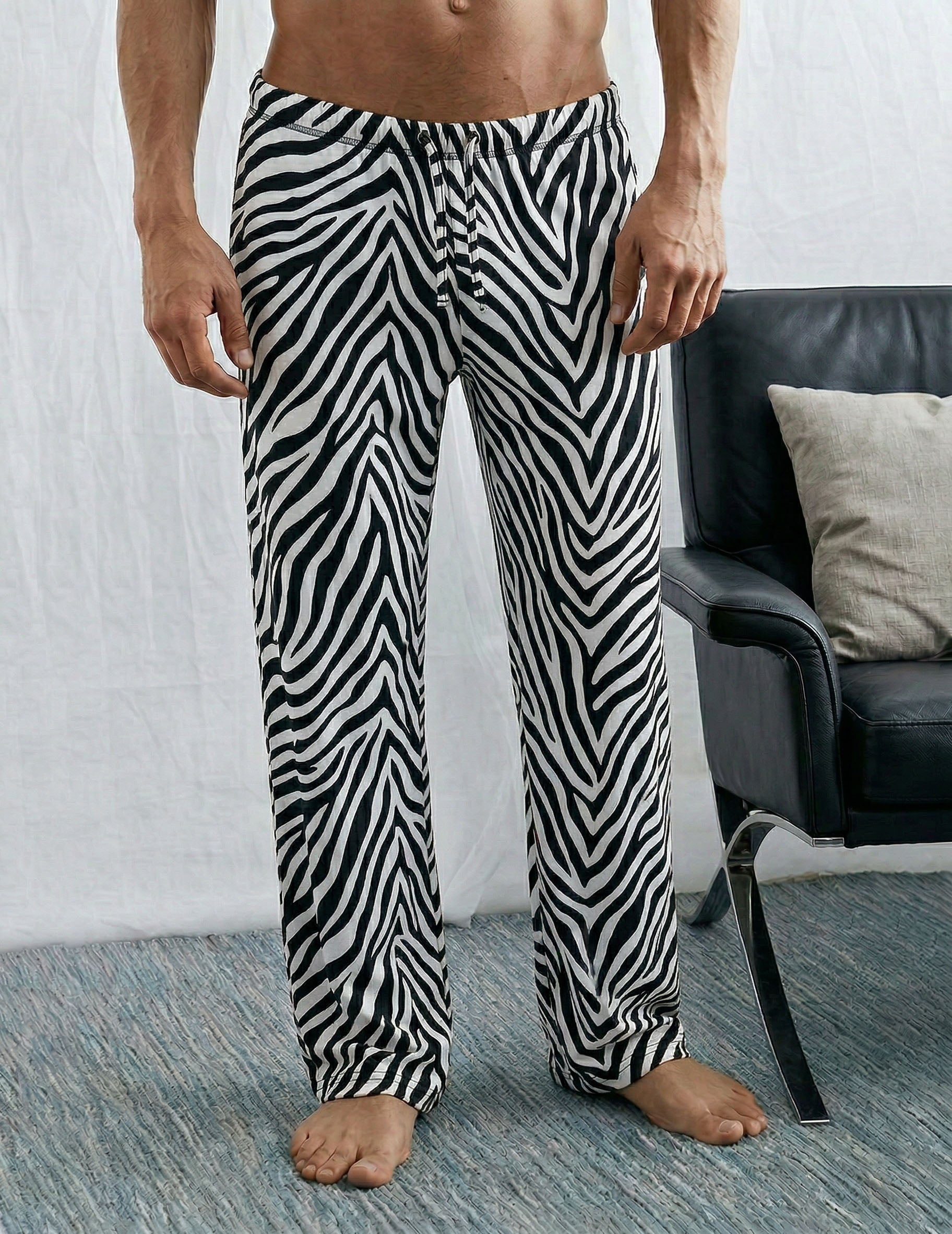 Men's lounge pants, zebra stripes, drawstring waist, tapered legs.