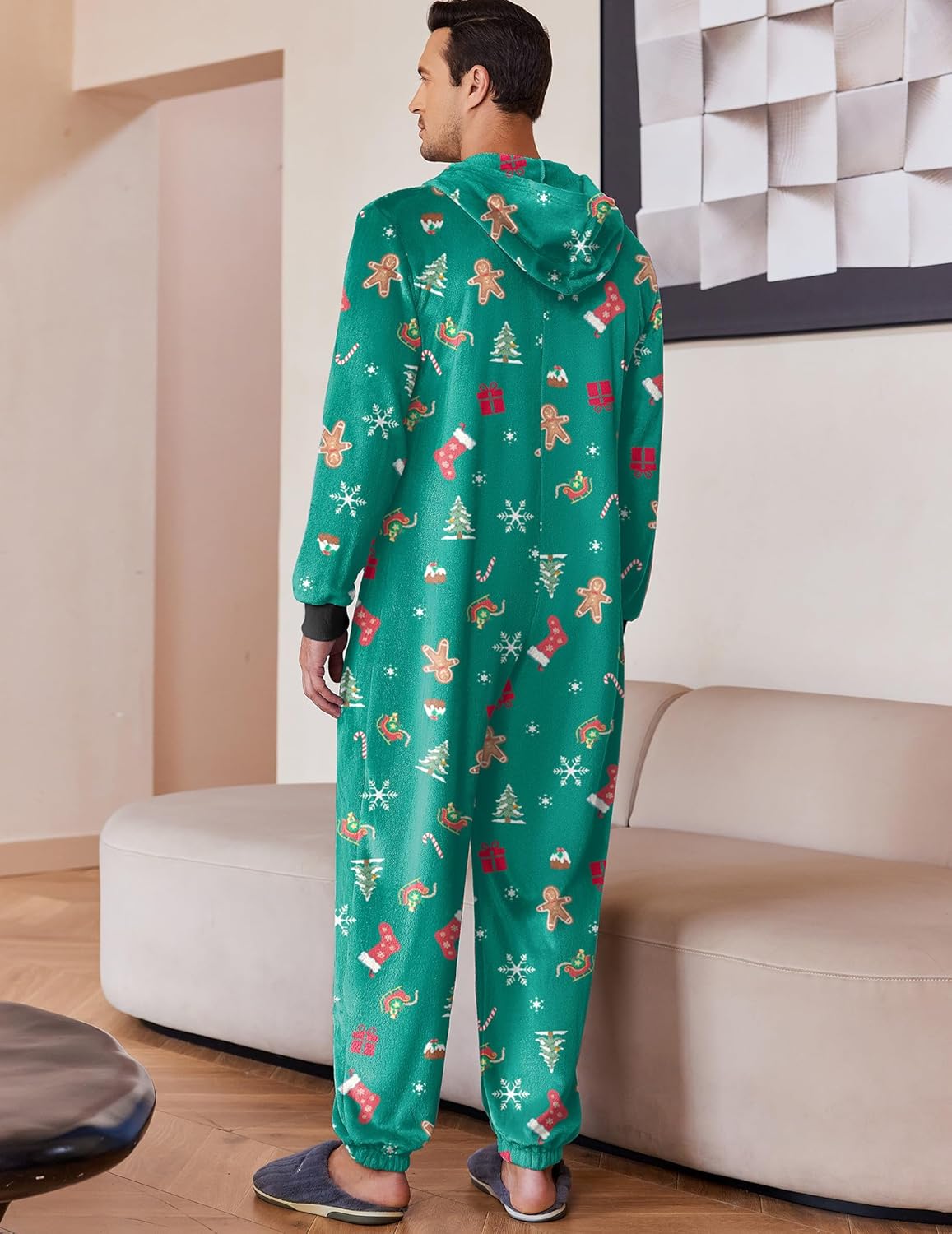 Green hooded fleece onesie pajama, back view, allover Christmas print and cuffs