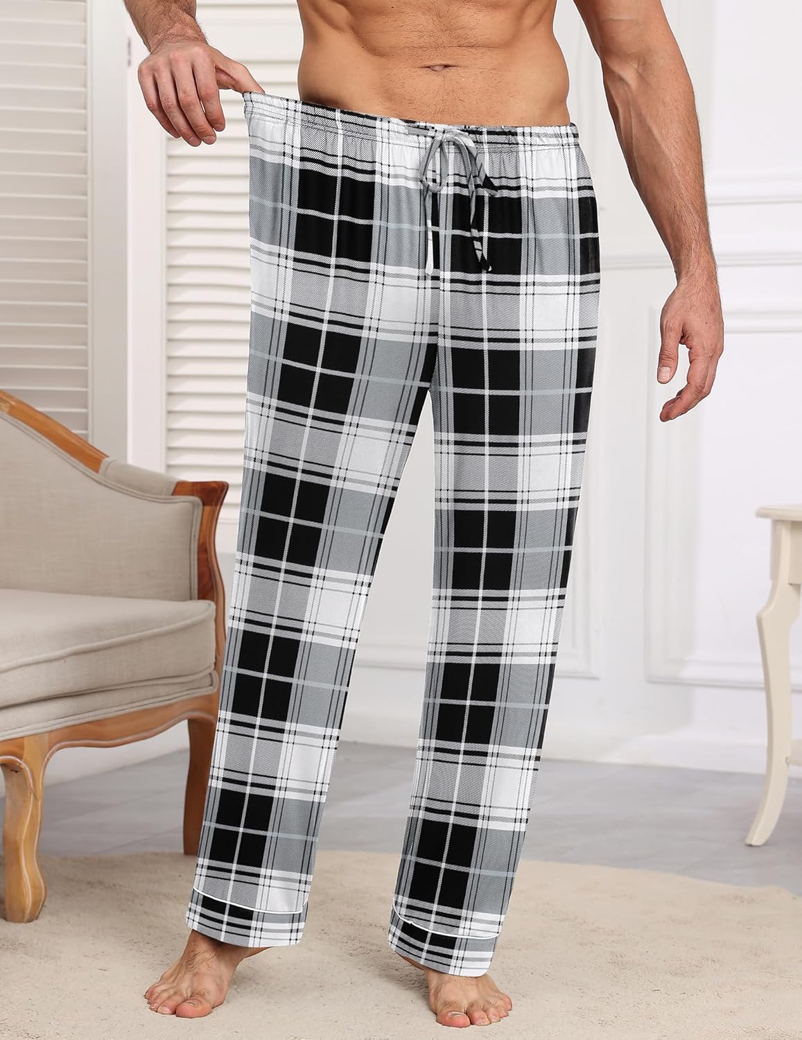 Men’s black, white, and gray plaid pajama pants with elastic waistband