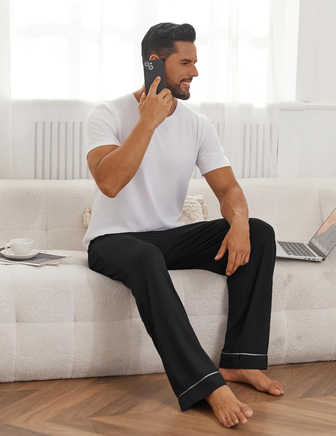 Black mens pajama pants with contrast trim on cuffs and relaxed leg fit